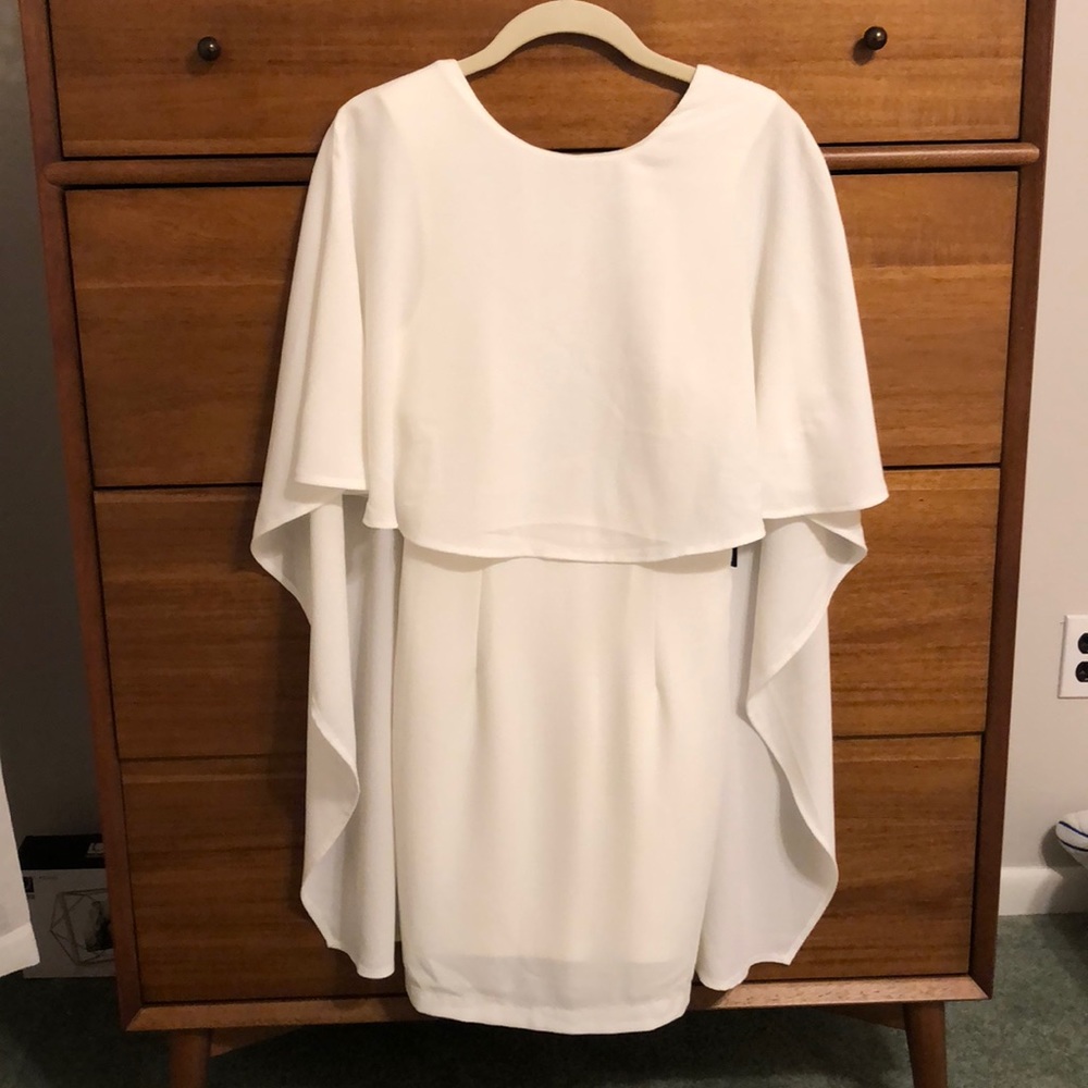 White backless dress “best is yet to come”